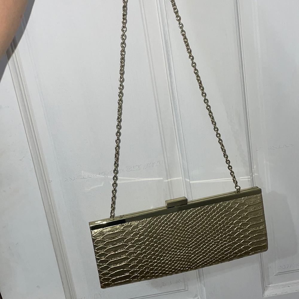 Gold alligator skin clutch